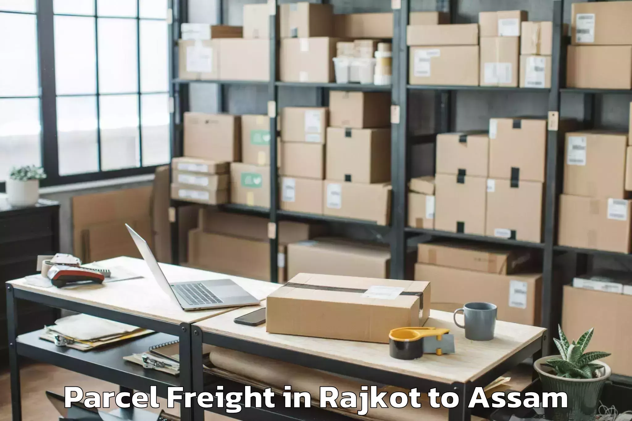 Book Rajkot to Dibrugarh University Parcel Freight Online